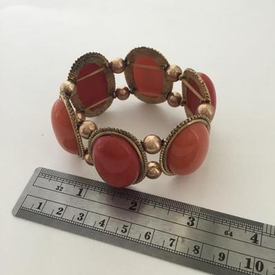 Gold tone red and orange stretchy fashion bracelet