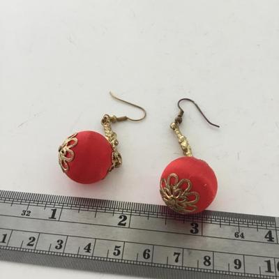 Gold tone red dangle earrings