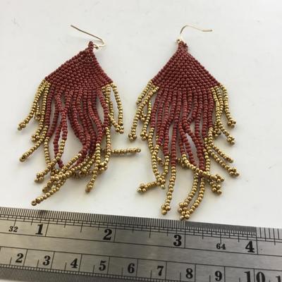 Red gold tone dangle beaded earrings