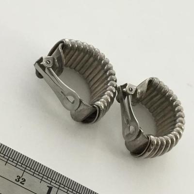 Silver tone clip on statement earrings
