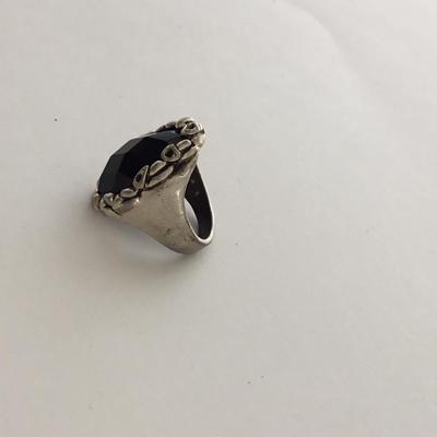 Unmarked black center silver tone ring