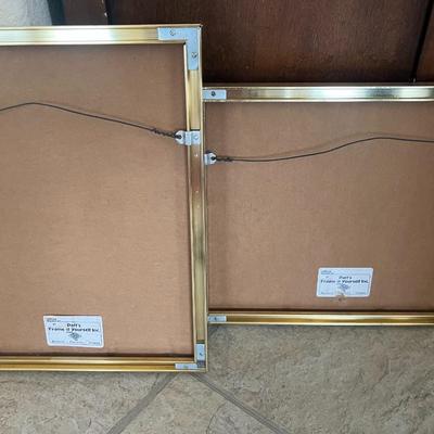 Framed art with red ink pictures