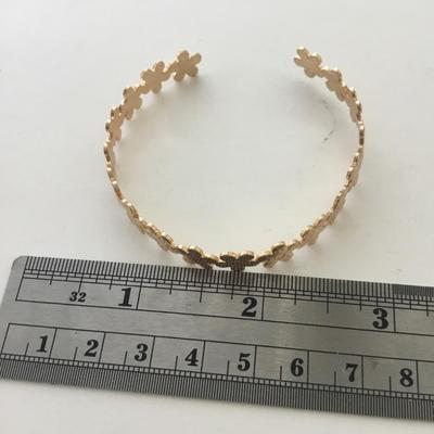 Gold tone flower cuff bracelet