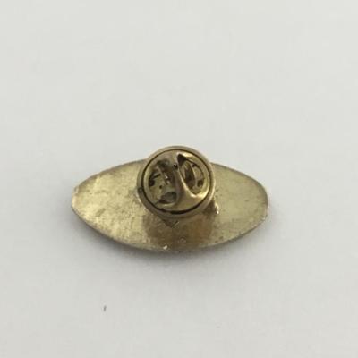 Gold tone vintage football pin