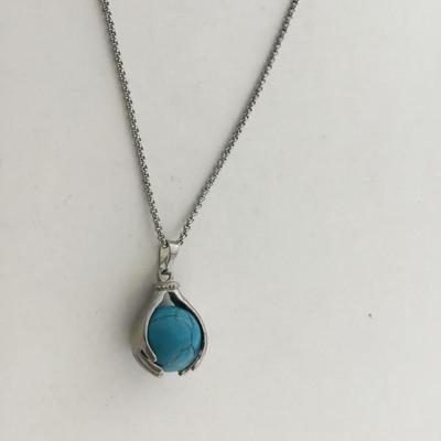 Silver tone fashion hands holding world necklace
