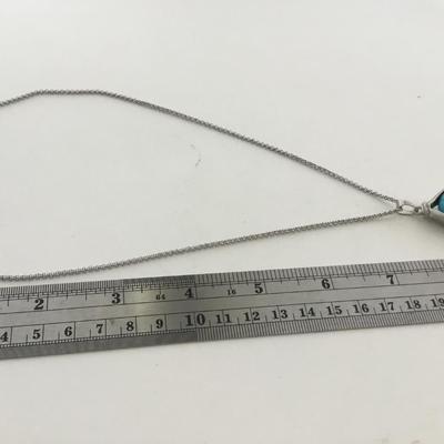 Silver tone fashion hands holding world necklace