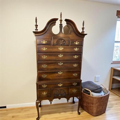 Queen Anne Style Highboy Chest of Drawers featuring a decorative pediment with finials,