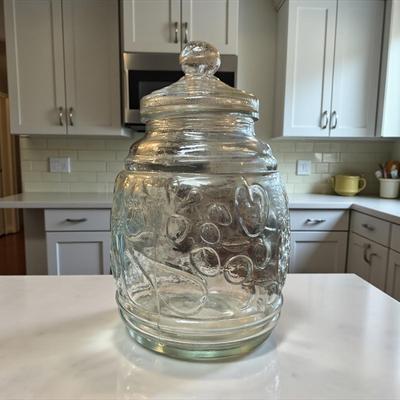 Clear Glass Cookie Jar or Canister with an embosses Fruit Design and a Lift Off Lid