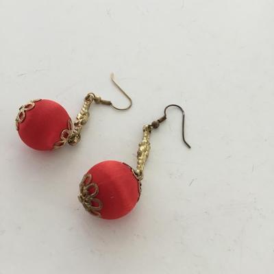 Gold tone red dangle earrings