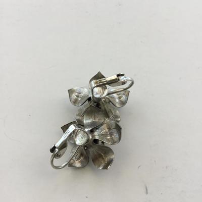 Silver tone flower clip on earrings