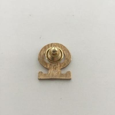 Gold tone discovery toys push pin