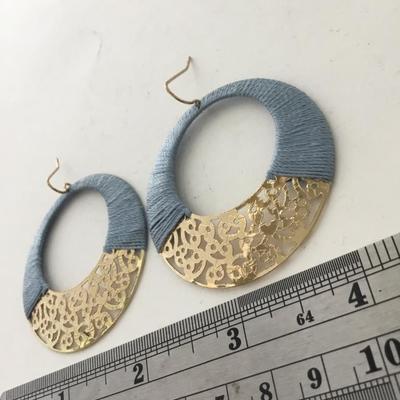Gold tone light blue round fashion earrings