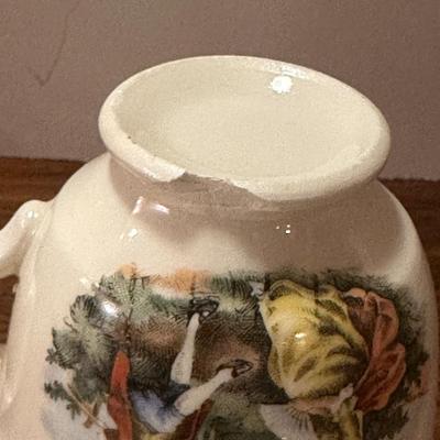 Miniature 2 Saucers and Teacup (with chip)