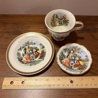 Miniature 2 Saucers and Teacup (with chip)