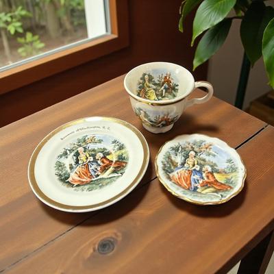 Miniature 2 Saucers and Teacup (with chip)