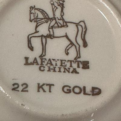 Miniature 2 Saucers and Teacup (with chip)