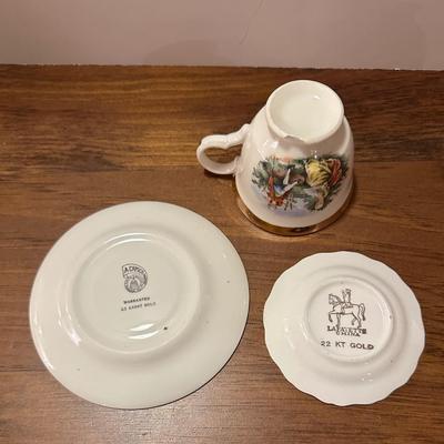 Miniature 2 Saucers and Teacup (with chip)