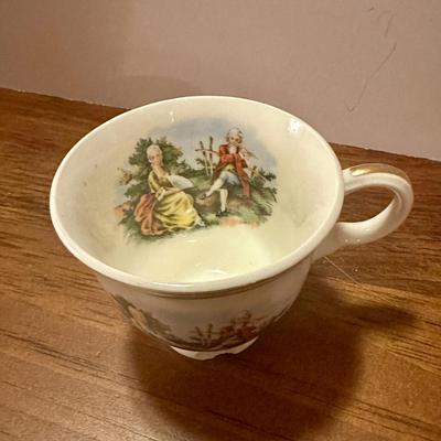 Miniature 2 Saucers and Teacup (with chip)