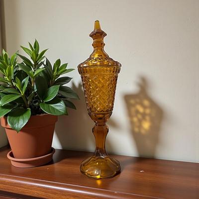 Tall, brown glass lidded Jar