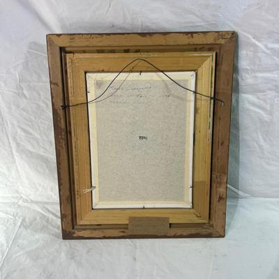 Bright green painted wood frame with oil painting of veggies
