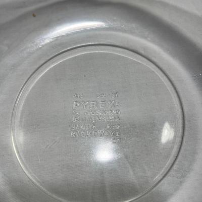 Two Vintage Pyrex dishes with woven basket