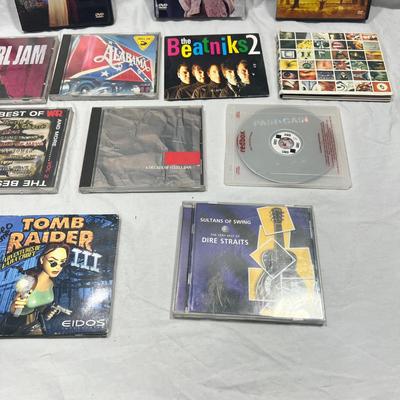 An assortment of DVD's, Cd's, and video Games