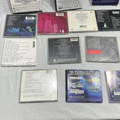 An assortment of DVD's, Cd's, and video Games