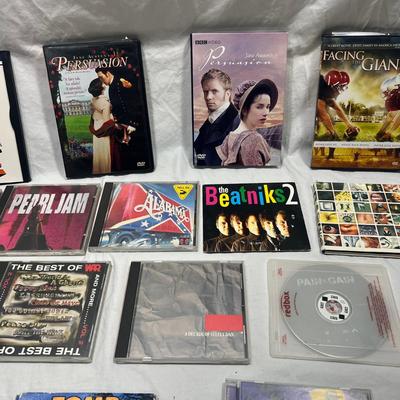 An assortment of DVD's, Cd's, and video Games