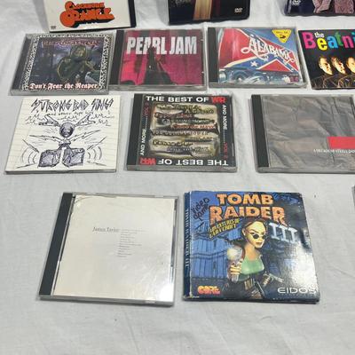 An assortment of DVD's, Cd's, and video Games
