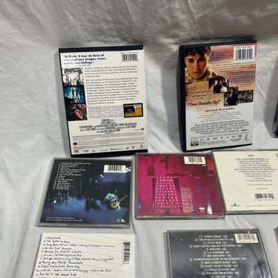 An assortment of DVD's, Cd's, and video Games