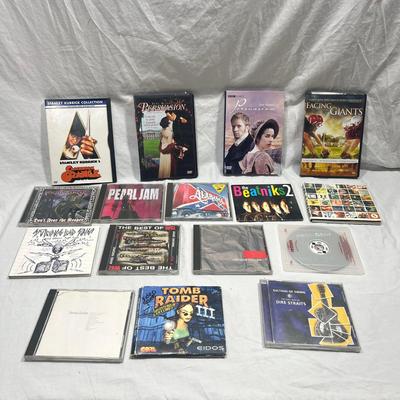An assortment of DVD's, Cd's, and video Games