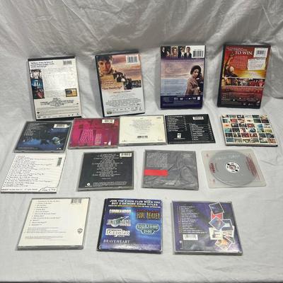 An assortment of DVD's, Cd's, and video Games
