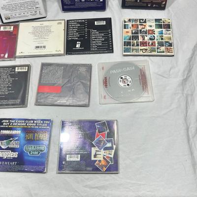 An assortment of DVD's, Cd's, and video Games