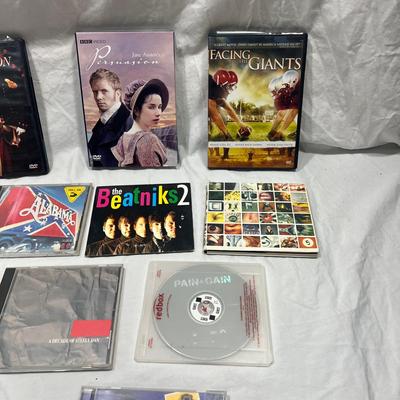 An assortment of DVD's, Cd's, and video Games