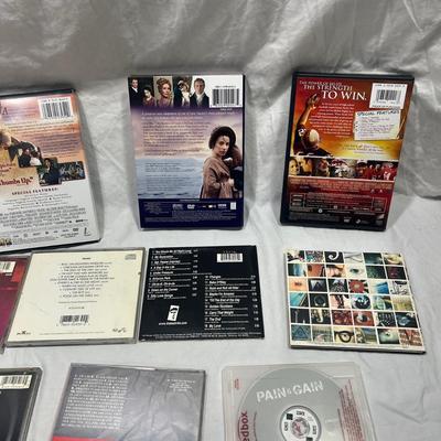 An assortment of DVD's, Cd's, and video Games