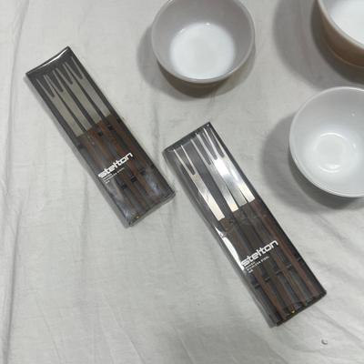 Brown and white Federal mixing bowls with vintage fondue skewers