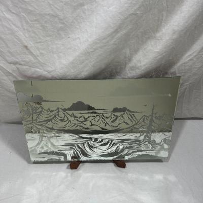 Sandblasted art onto mirror of mountains