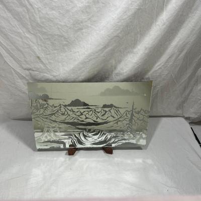 Sandblasted art onto mirror of mountains