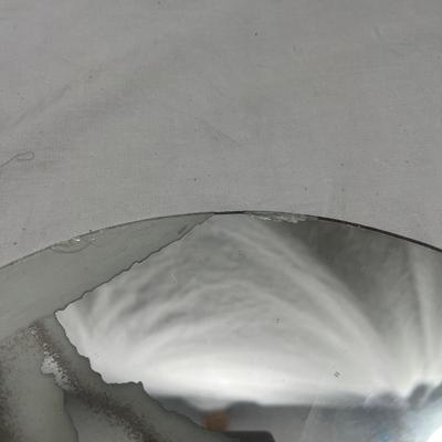 Sandblasted art onto mirror of aircraft carriers with bombers taking off