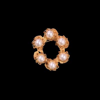 Set of Four Gold Toned Brooches