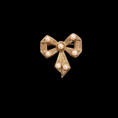 Set of Four Gold Toned Brooches