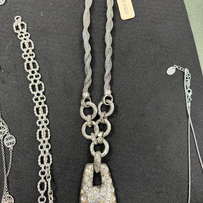 Set of 4 Silver Toned Necklaces