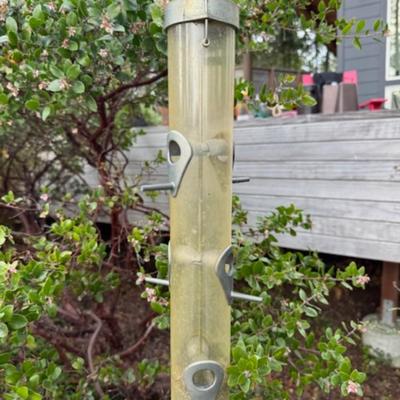 TWO BIRD FEEDERS HANGING