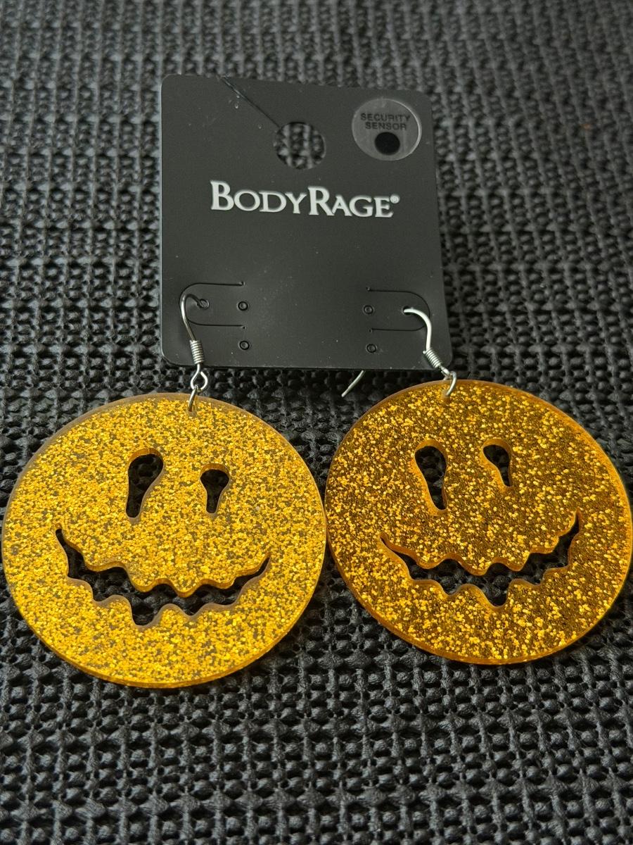 Body Rage glitter pumpkin drop earrings made of acrylic material ...
