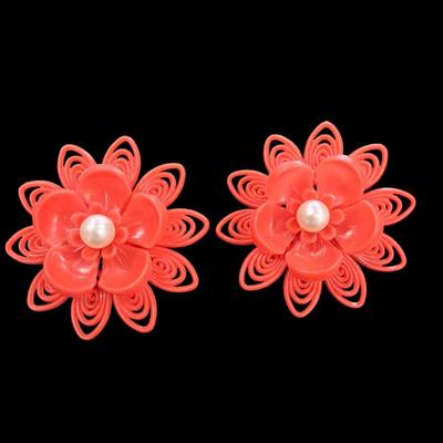 Pair Of Vintage Orange Plastic Clip On Flower Earrings with a Faux Pearl Center