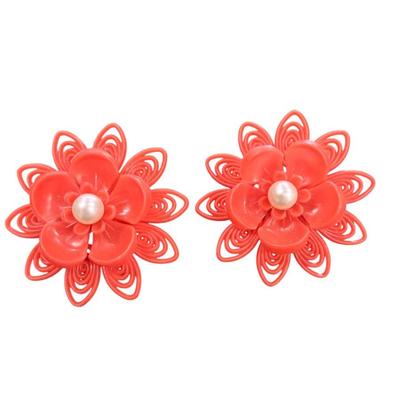 Pair Of Vintage Orange Plastic Clip On Flower Earrings with a Faux Pearl Center