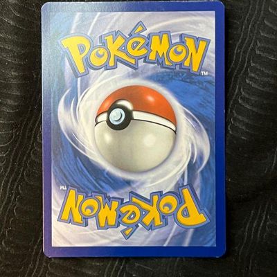 Back side of an original Pokémon trading card featuring the classic blue border and Poké Ball design.