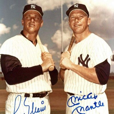 Autographed vintage color photo print featuring New York Yankees legends Roger Maris and Mickey Mantle holding baseball bats.