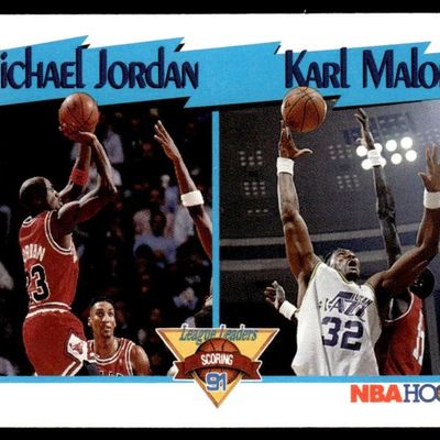 Sale Photo Thumbnail #26: 1990-91 NBA Hoops League Leaders basketball trading card featuring Michael Jordan and Karl Malone.