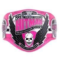 WWE Bret "Hitman" Hart signature series championship replica title belt, featuring a pink strap and custom plates with his...